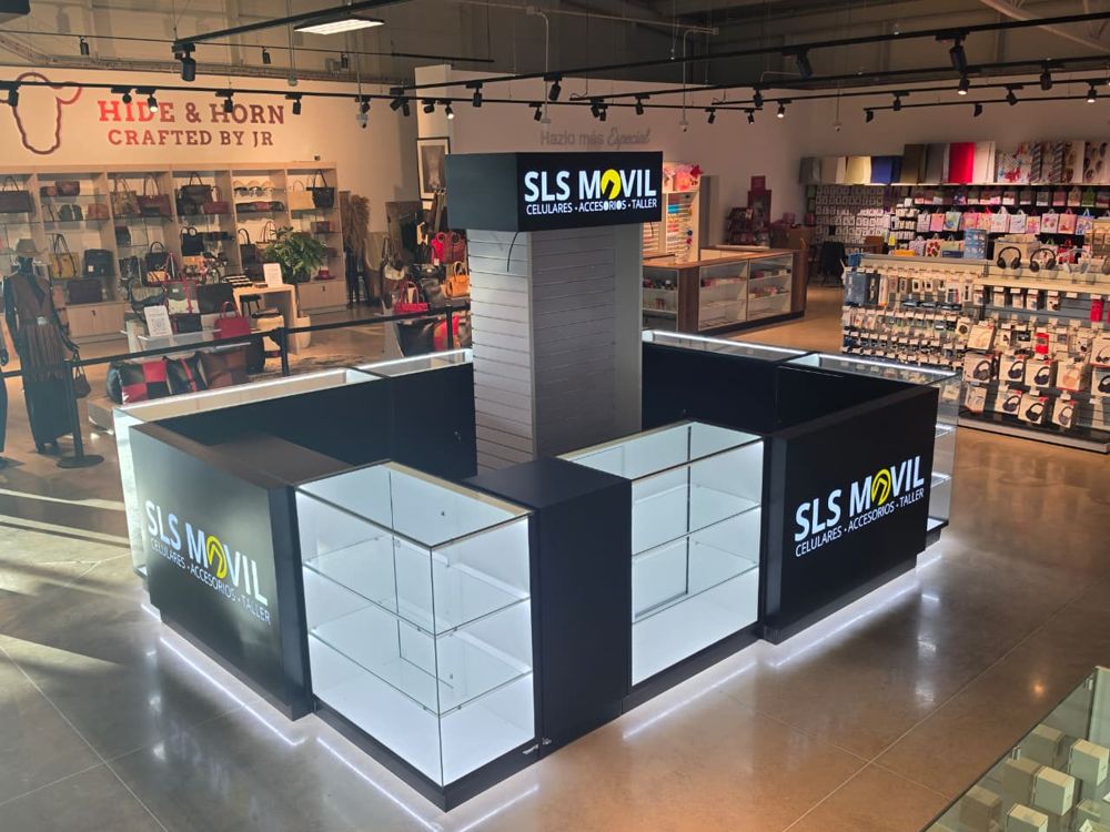 Kiosco visto de lado con dos rótulos SLS Móvil